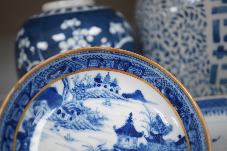 An 18th century Chinese export blue and white plate, together with two other dishes and two ginger jars. Condition - varies